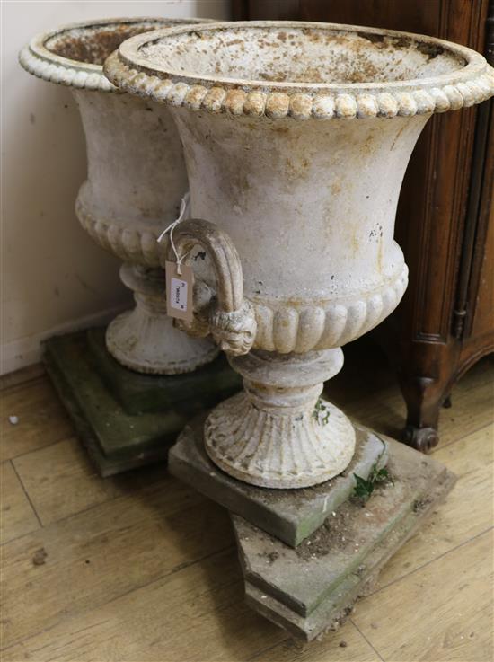 A pair of Victorian cast iron campana-shaped urns, H.58cm